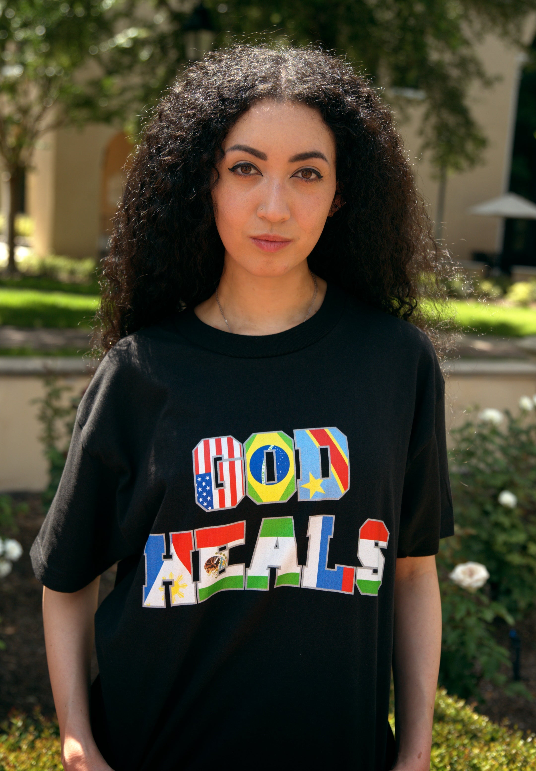 God Heals International Black Tee